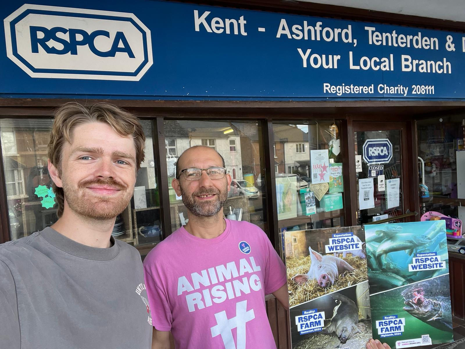 Two Animal Rising supporters outside the Kent RSPCA branch with evidence of animal cruelty